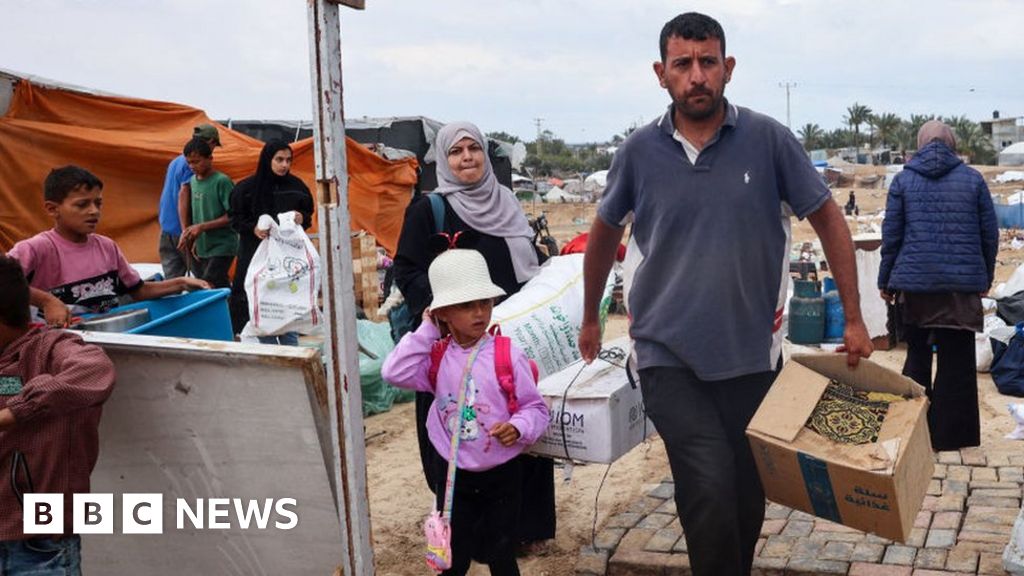 Palestinians pack their belongings as they prepare to flee Rafah in southern Gaza