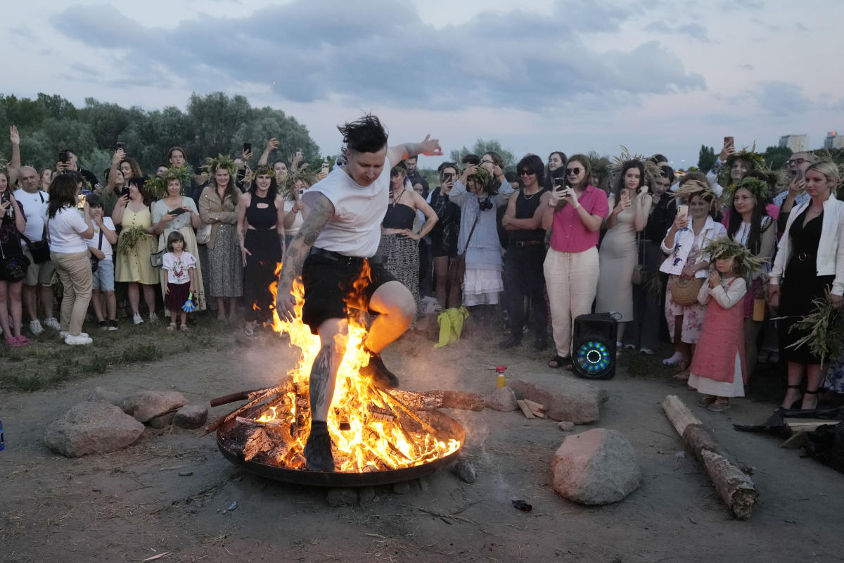 Ukrainians in Warsaw jump over a bonfire, float braids to celebrate solstice custom away from home