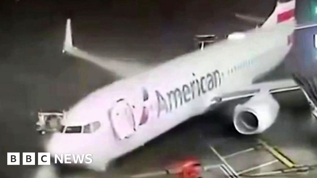 Strong winds push parked plane away from airport gate