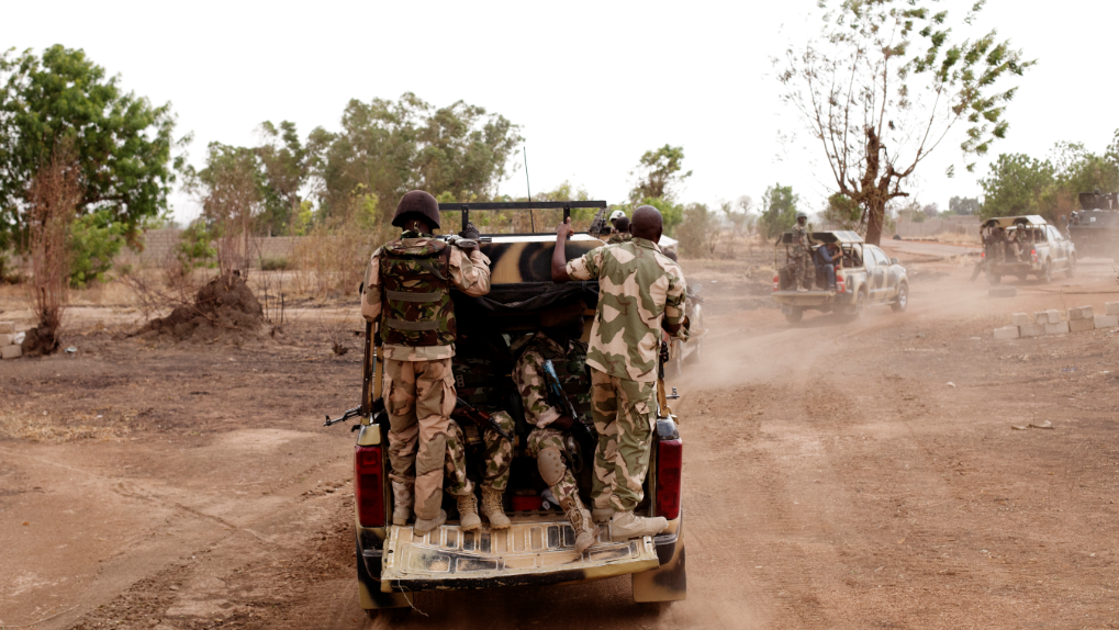 Soldiers on the back of a military truck in Gwoza