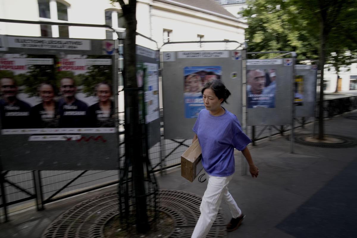 The Latest | Polls are open in France's early legislative election