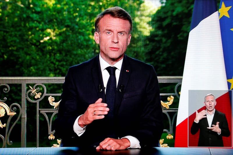 A screen shot shows French President Emmanuel Macron speaking during a televised address to the nation during which he announced he is dissolving the National Assembly, French Parliament lower house, and calls new general elections on 30 June. Ludovic Marin/AFP/dpa