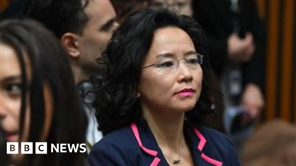 Chinese officials appear to block freed journalist from view in Canberra