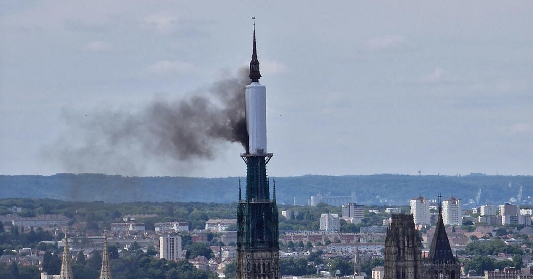 Covering of Spire of Rouen Cathedral in France Catches Fire