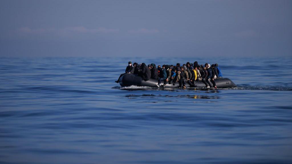 People cross the English Channel in an inflatable dinghy in March 2024