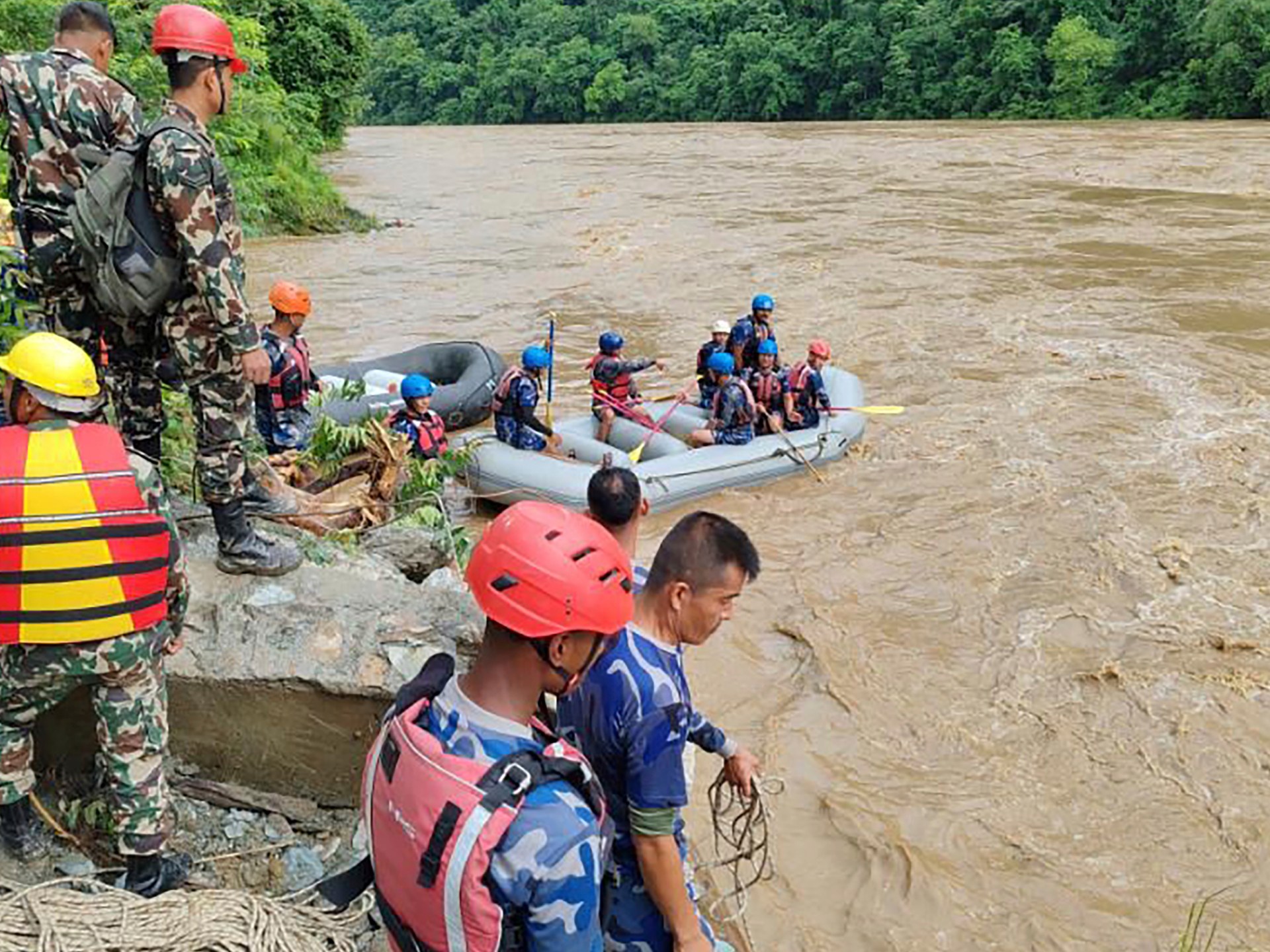 More than 60 people missing after two buses swept into river in Nepal | Weather News