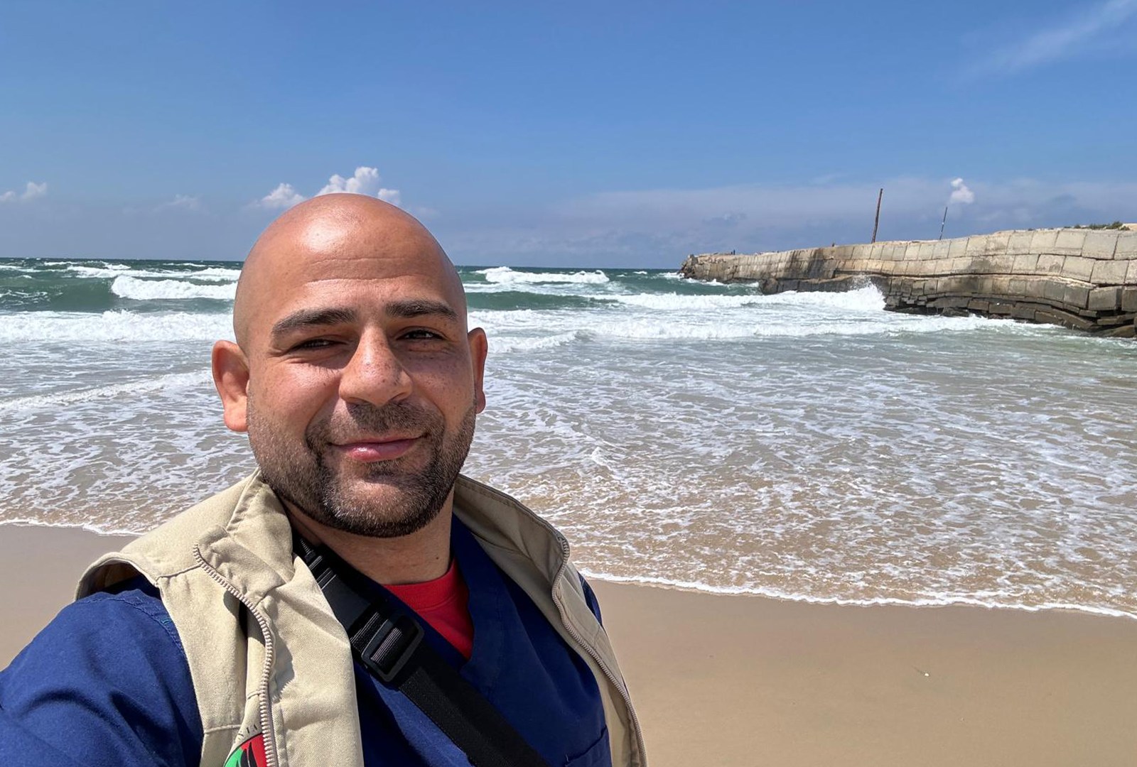 Omar Sabha takes a selfie on the sandy shores of the Mediterranean Sea