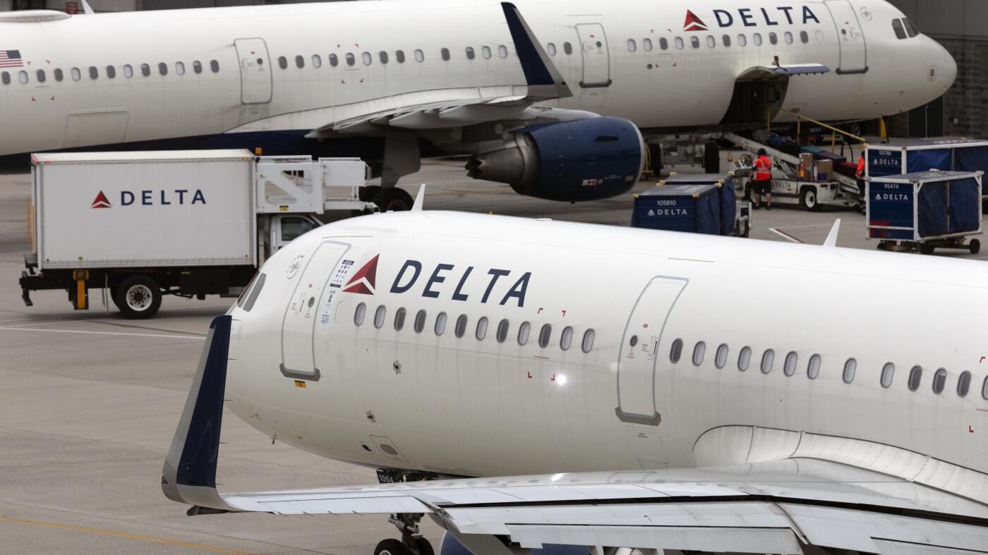 Delta's flight delays and cancelations prompt Dept. of Transportation investigation : NPR