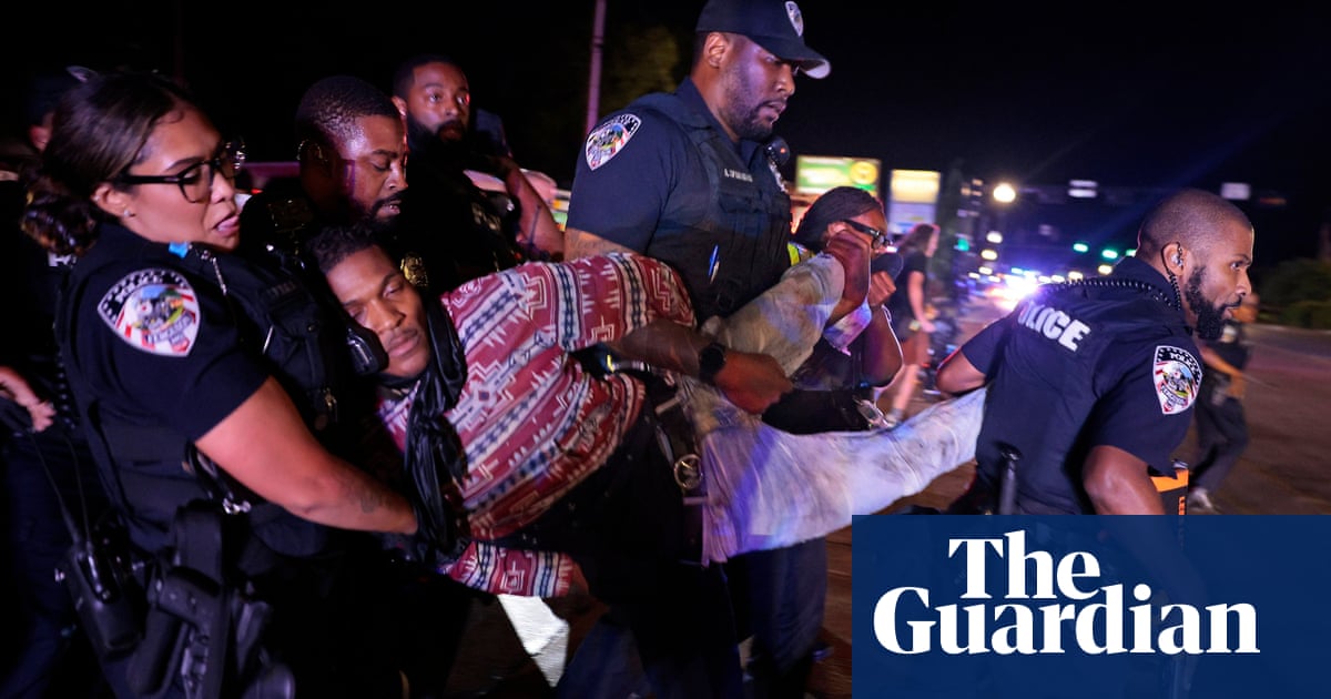 Ferguson police officer suffers critical brain injury in Michael Brown anniversary violence | Michael Brown shooting