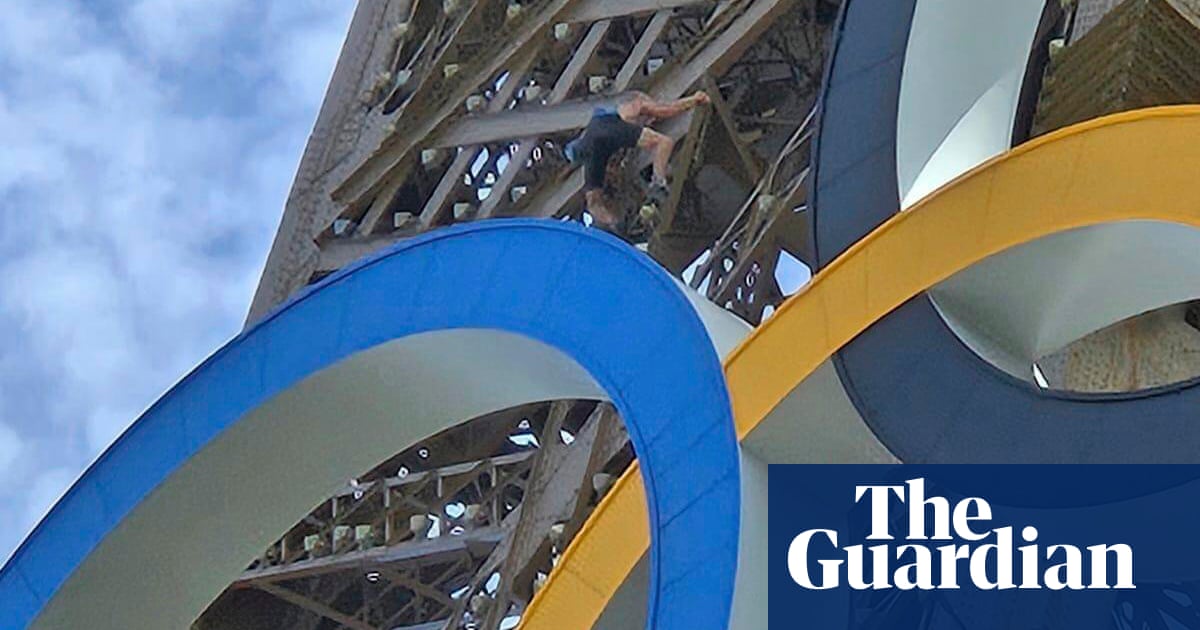 ‘Bloody warm, innit?’ says man scaling Eiffel Tower on last day of Olympics | Paris