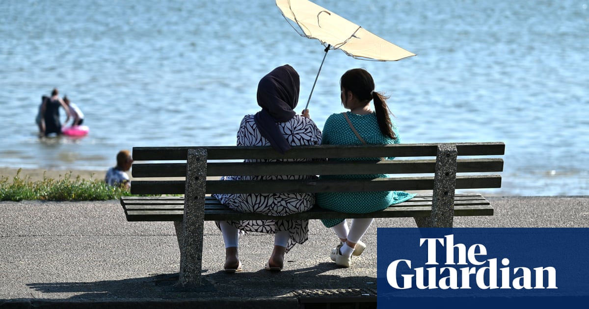 Temperature reaches 34.8C on UK’s hottest day of year | UK weather