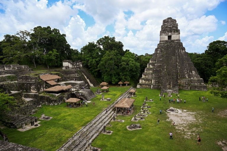 Tourists walk by the "Great Jaguar" Mayan temple at the Tikal archaeological site in the Maya Biosphere in Peten, Guatemala, July 24, 2024. (JOHAN ORDONEZ)