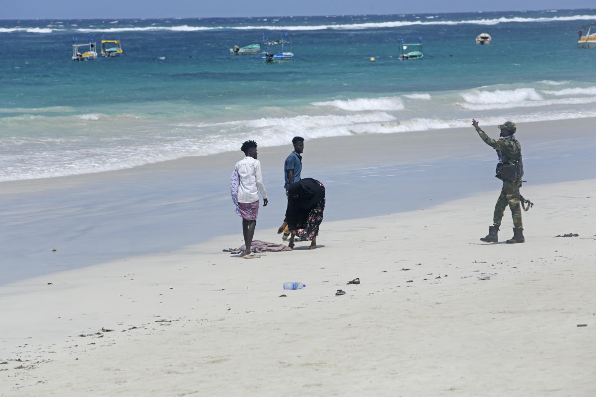 Hundreds gather at Somalia beach to condemn attack that killed 37 and demand stronger security