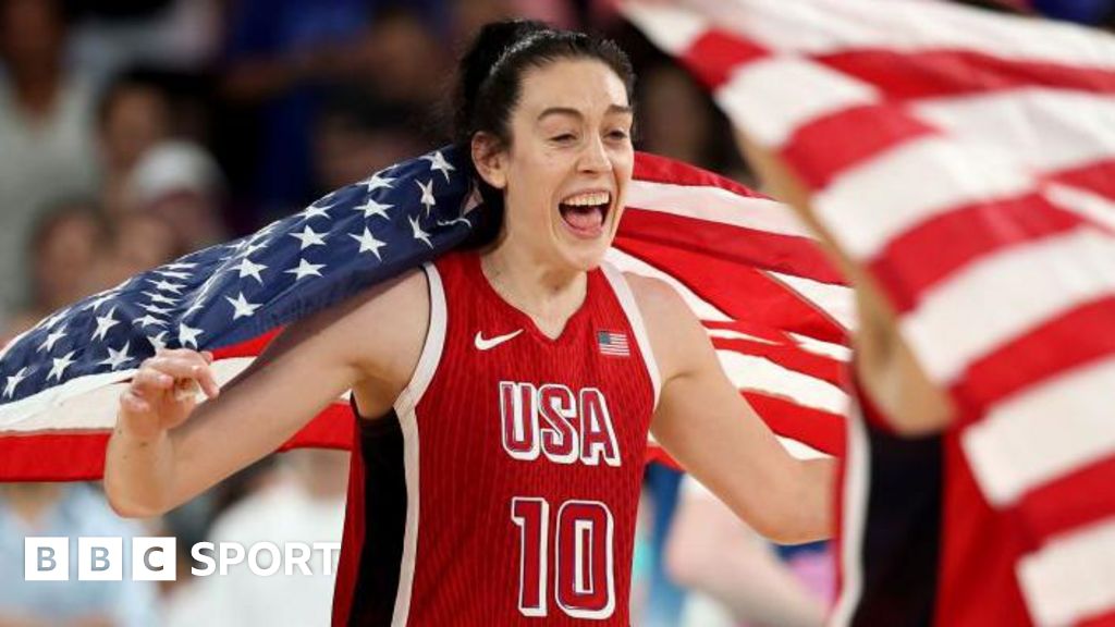 Breanna Stewart celebrates with a US flag