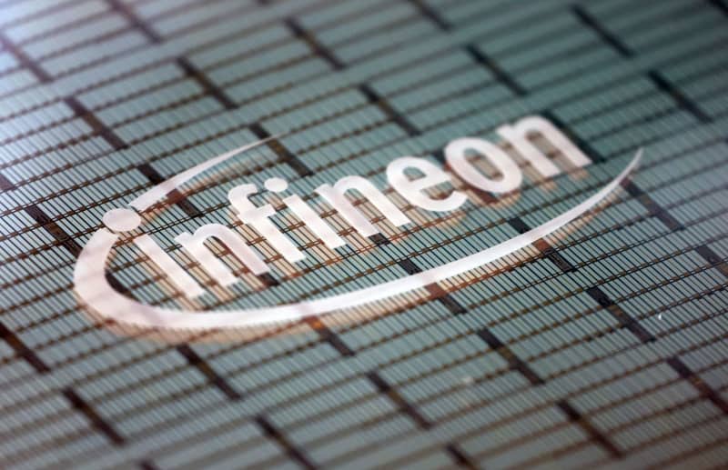 The Infineon logo can be seen on an electronic component. Karl-Josef Hildenbrand/dpa