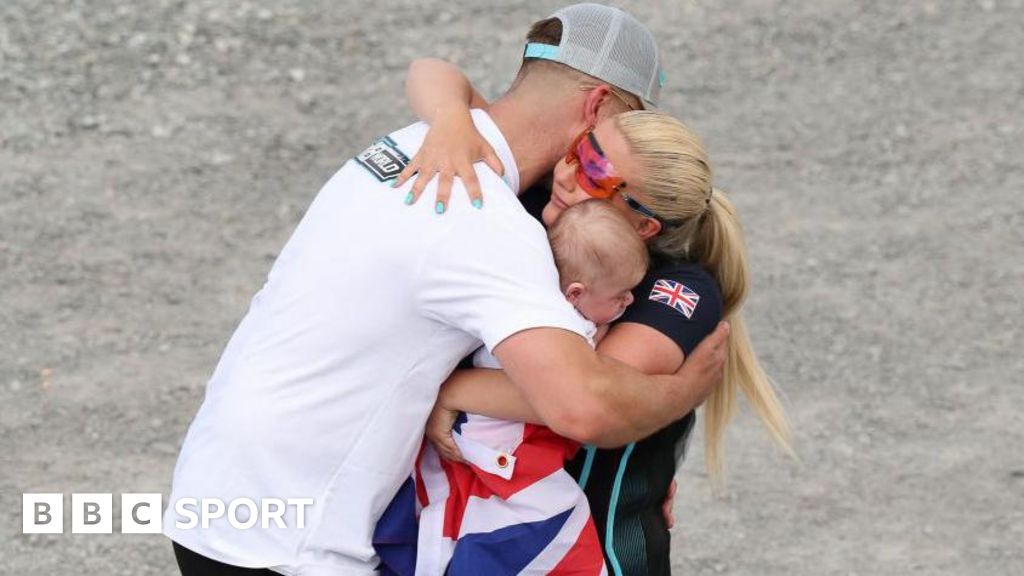 Amber Rutter celebrates skeet shooting silver with husband and baby boy