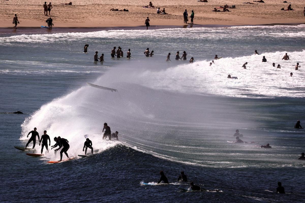 Australia sweats under record triple-digit heat — in the heart of winter