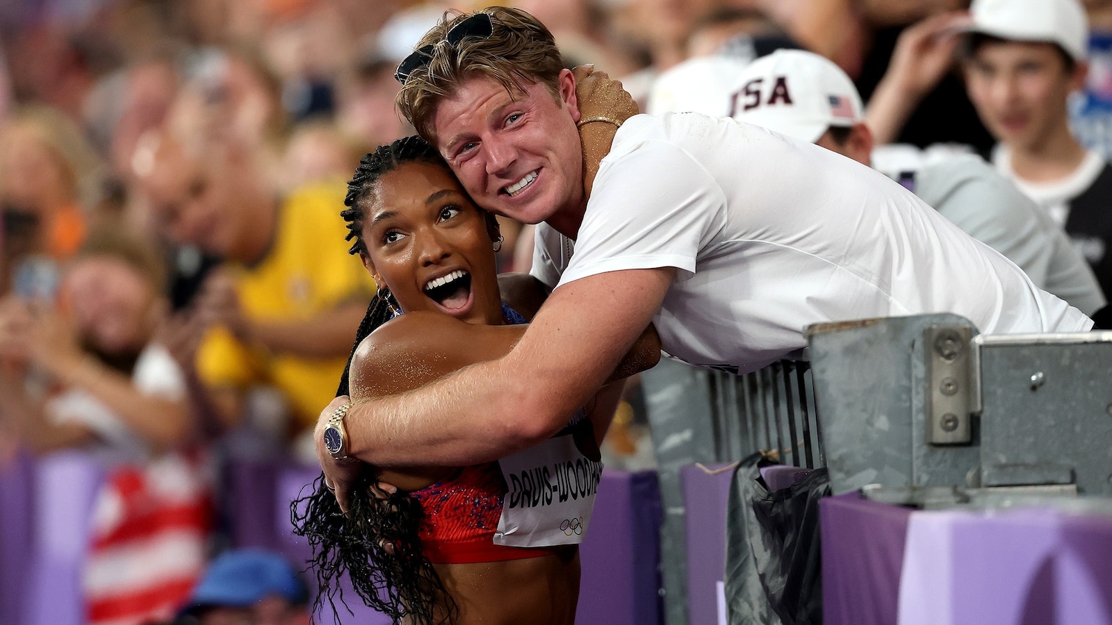 Olympic power couple Tara Davis-Woodhall and Hunter Woodhall celebrate gold medal win