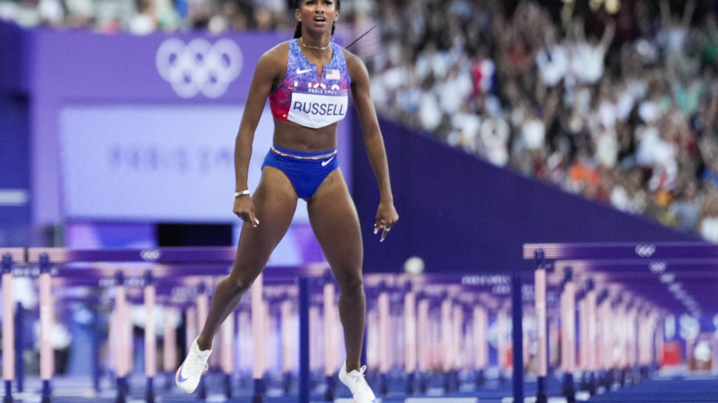 American Masai Russell wins gold in 100 meter hurdle by a hundredth of a second : NPR