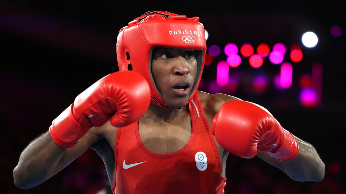 Boxer Cindy Ngamba wins Olympic refugee team’s first medal : NPR