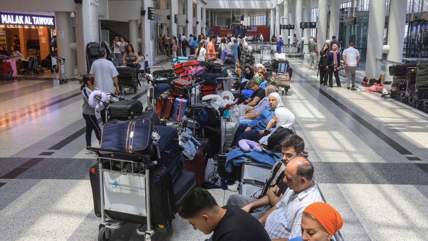 Lebanon war fears and flight cancellations send travelers scrambling : NPR