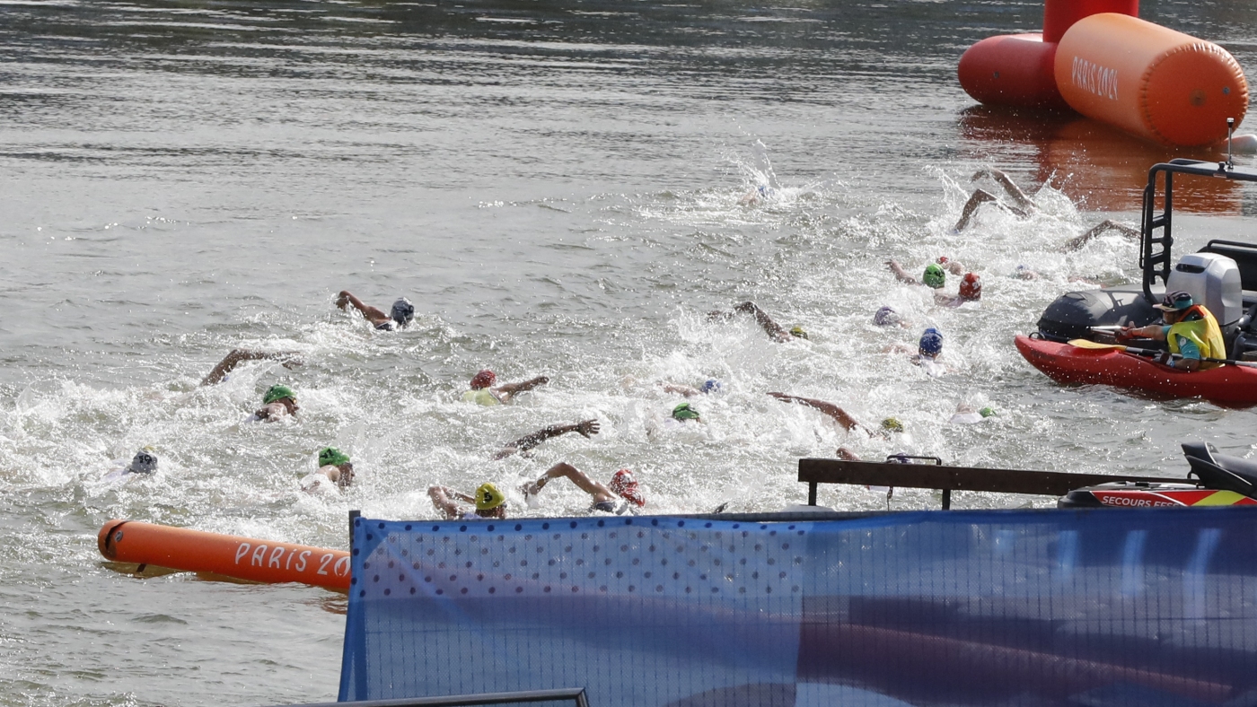 Belgian Olympian falls ill after swimming in Seine : NPR