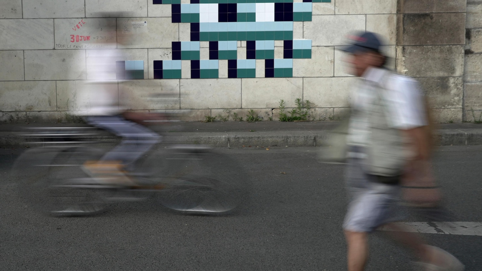 Mystery Paris street artist 'Invader' glues up new work to celebrate Olympics and delight fans