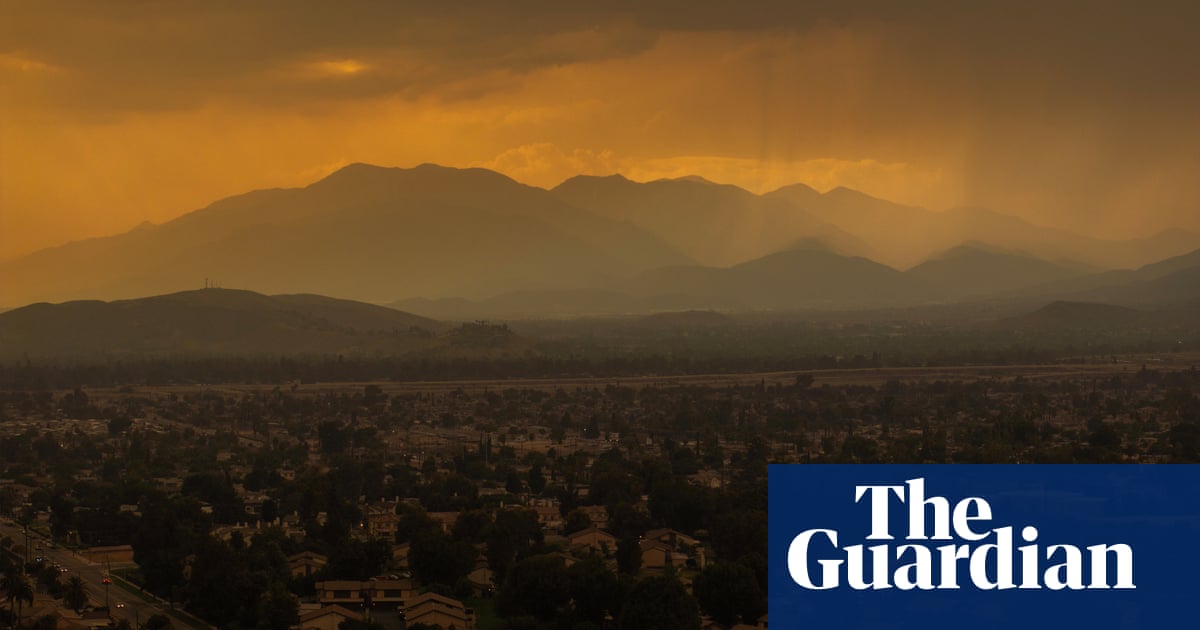 Fast-spreading wildfire east of LA forces thousands to flee amid fierce heatwave | California