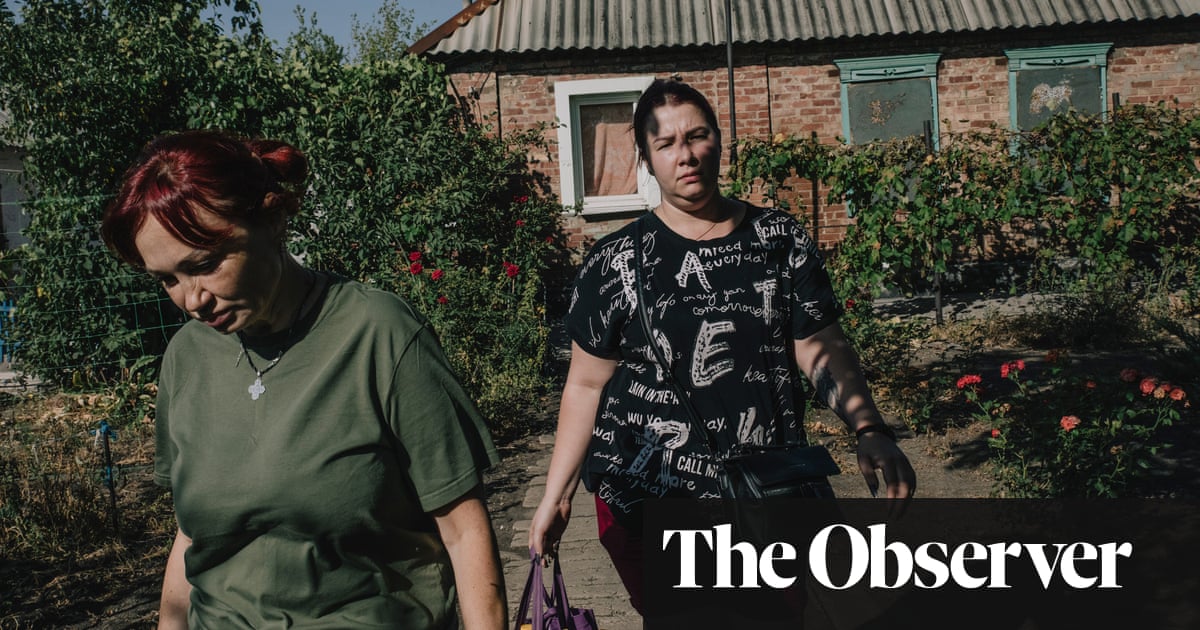 ‘Everything is left behind’: as Russians close in on Ukrainian city, families agonise whether to flee | Ukraine