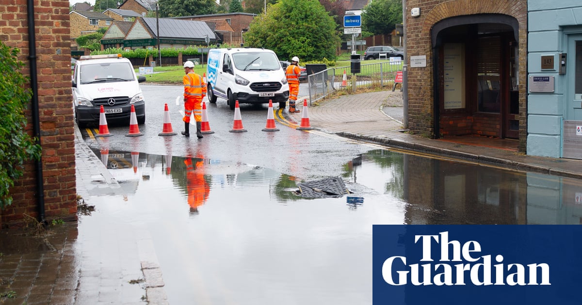 UK weather: commuters face travel disruption after heavy rainfall | UK weather