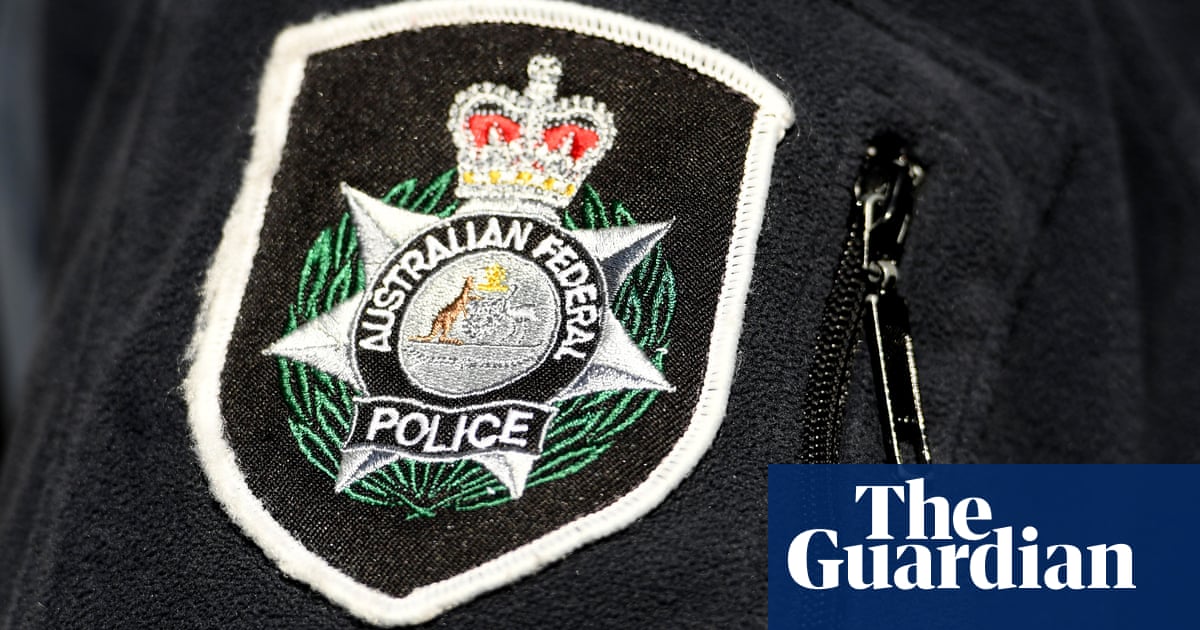 Sydney man charged over alleged fake terror plot as AFP crack secret messaging app | Australian federal police