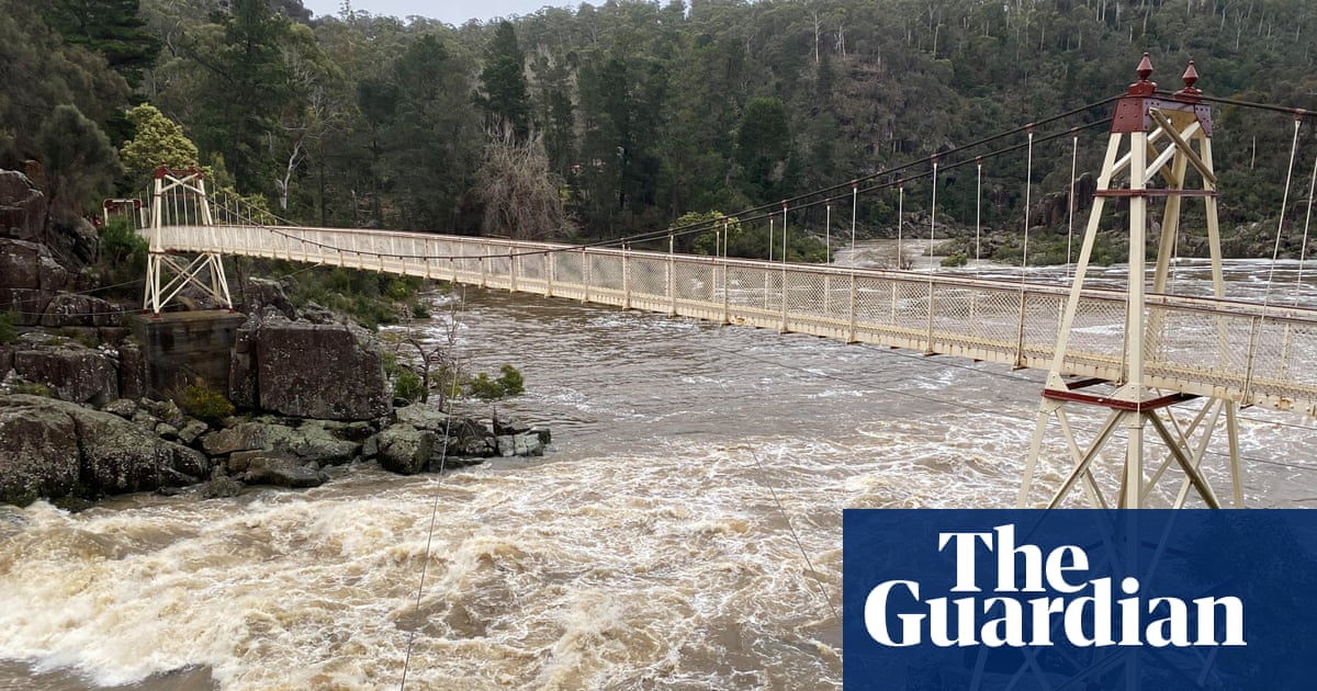 Tasmanians prepare to evacuate amid major flood warning as Victorians warned of destructive winds | Australia weather