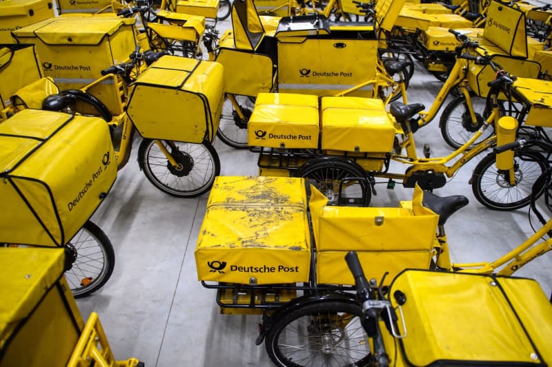 Deutsche Post bicycles are available at the Magdeburg-Buckau delivery base. Germany's postal service has won permission to raise postage costs for postcards and letters by around 10.5% starting early next year, Germany's Network Agency regulator said on Wednesday. Klaus-Dietmar Gabbert/dpa