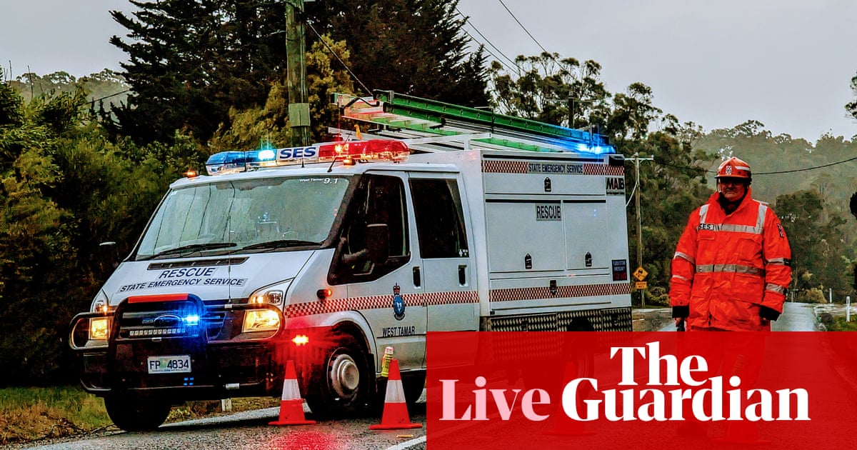 Australia news live: woman killed after tree falls on cabin; tens of thousands without power after night of wild storms | Australia news