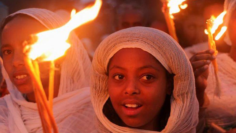 Ethiopia festival fires burn bright despite downpour