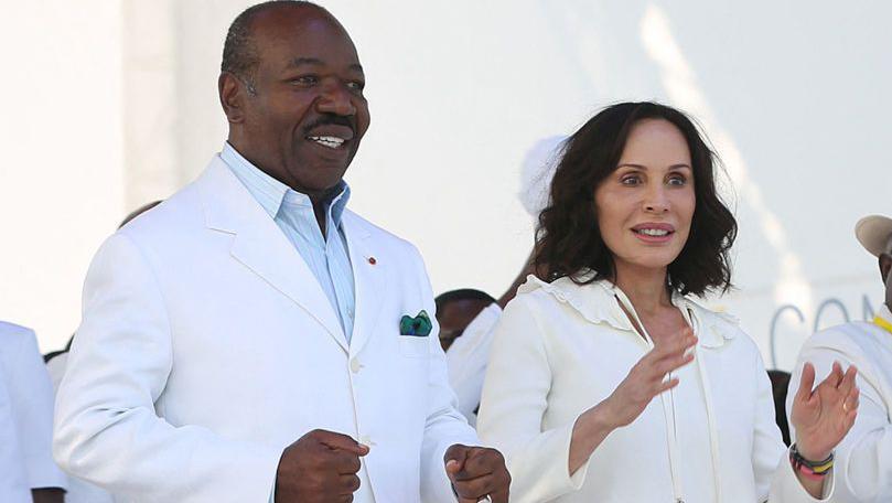 Gabon President Ali Bongo Ondimba (L) and Gabon First Lady Sylvia Bongo Ondimba (2nd L) are seen at the Nzang Ayong stadium in Libreville on July 10, 202