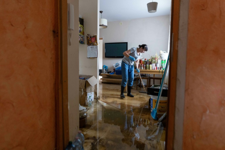 Agata Pioro cleaned up after the flood ruined her house in Glucholazy (Wojtek RADWANSKI)