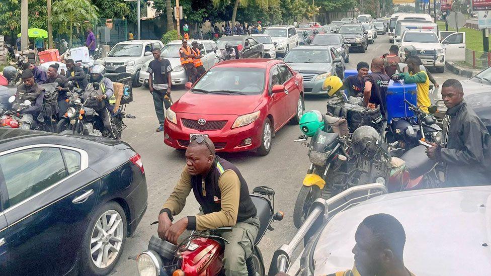 Cars and motorbikes queuing for fuel in Lagos, Nigeria - September 2024