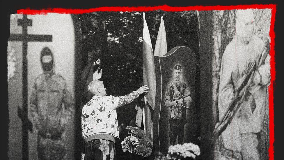 A woman in a graveyard in Kursk, Russia reaches out to touch a gravestone which has a picture of a soldier on it. There are other gravestones and images of soldiers on both sides of her.