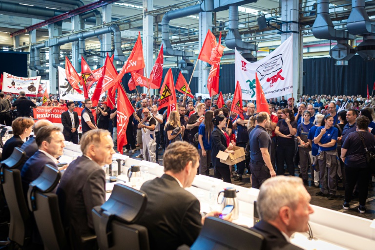 Employees of German car maker Volkswagen (VW) protest at the start of a company