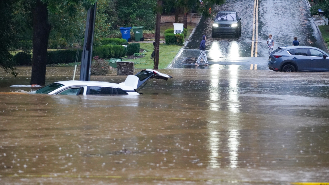 A meteorologist in Atlanta rescued a woman from Helene floodwaters on camera : NPR