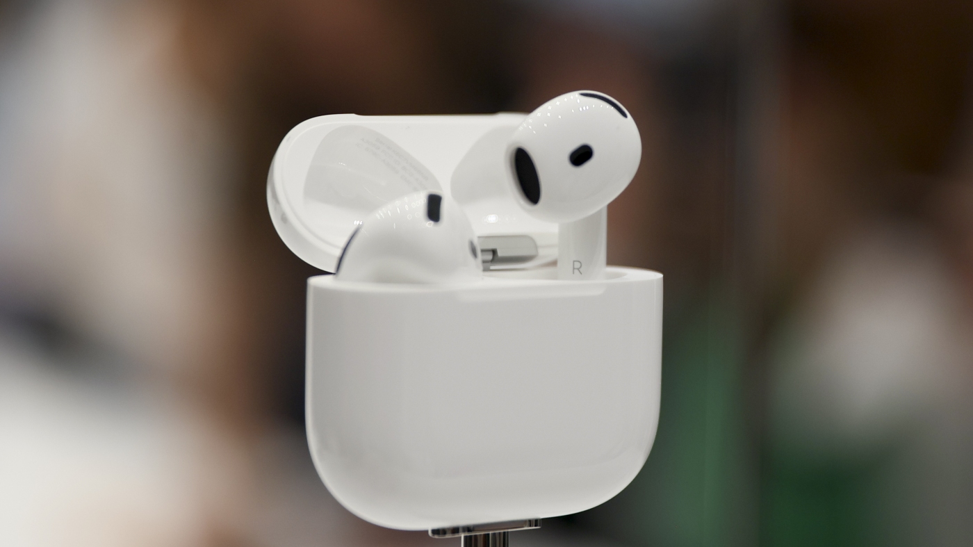 FDA approves some Apple AirPods to be used as hearing aids : NPR