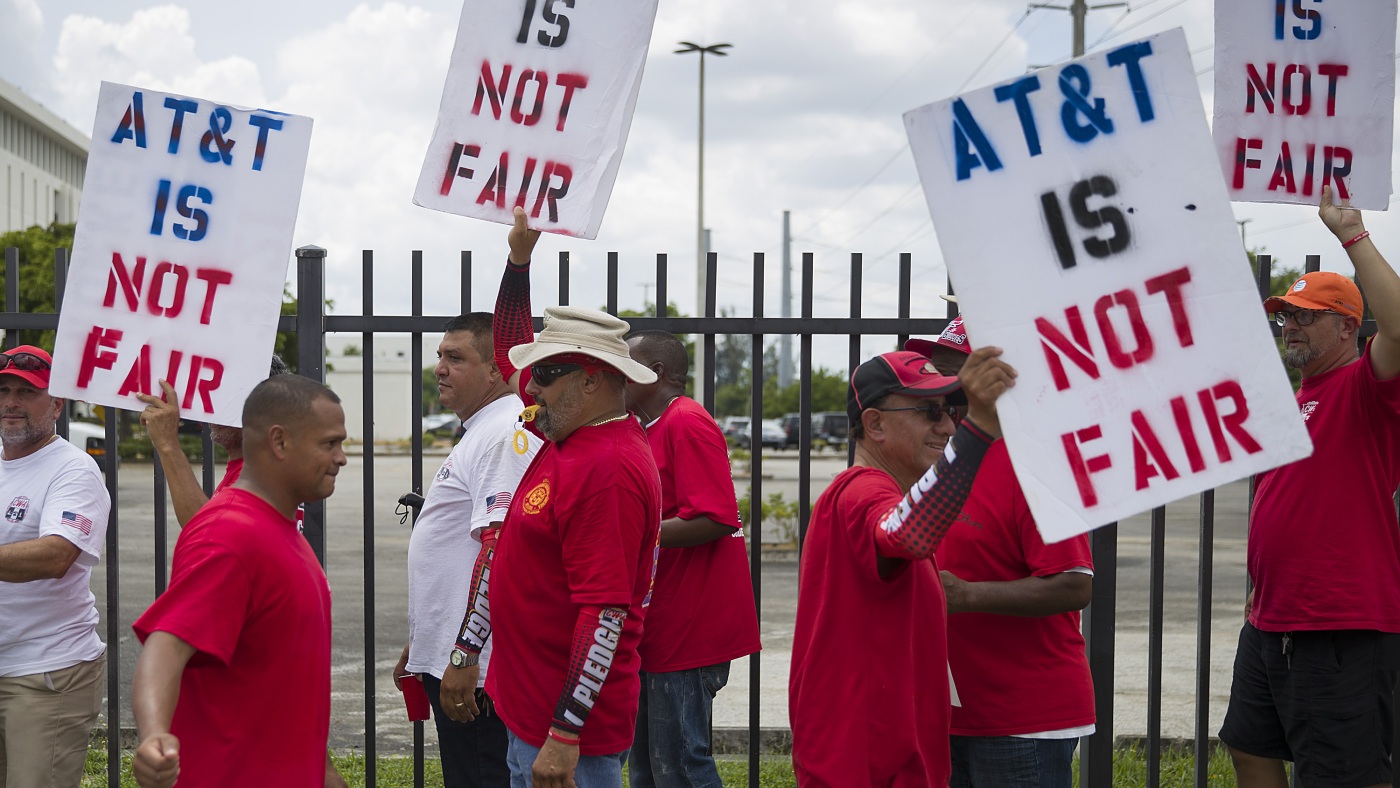 17,000 AT&T workers have been on strike for three weeks : NPR