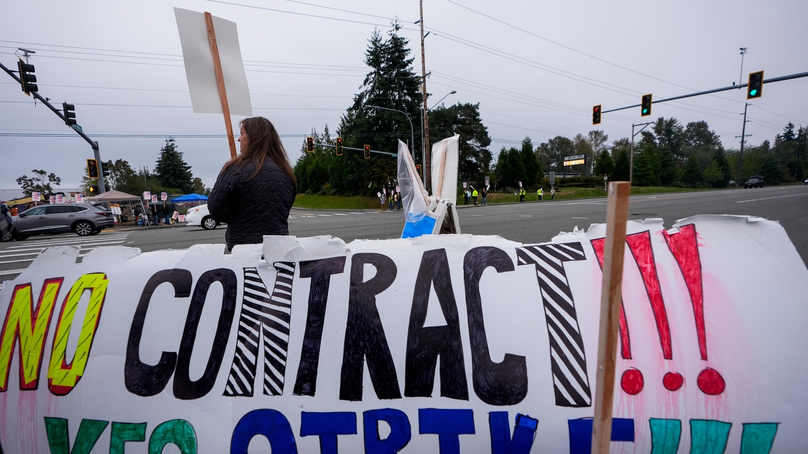 Boeing says it's considering temporary layoffs to save cash during the strike by machinists