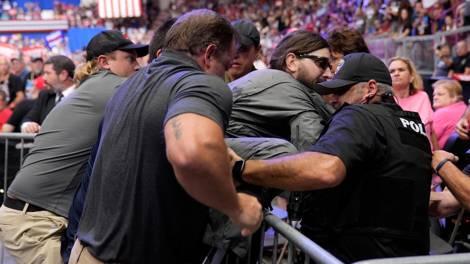 Man arrested at Trump rally wanted to hang a protest banner, police say