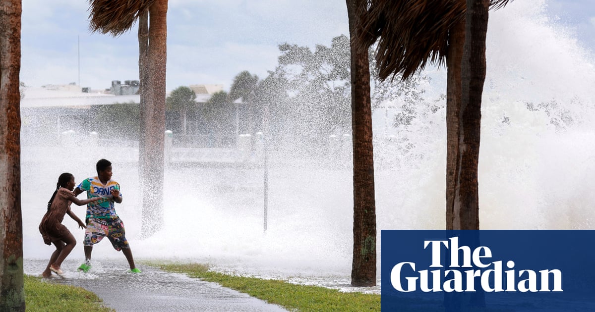 Florida man rescues neighbors on surfboard after Helene floods island city | Hurricane Helene