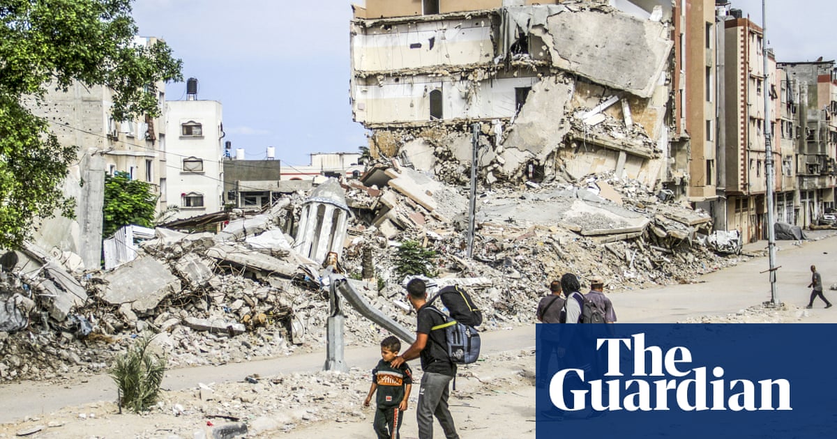 Israeli strikes kill dozens in Gaza’s Jabalia refugee camp, officials say, as thousands remain trapped | Israel-Gaza war