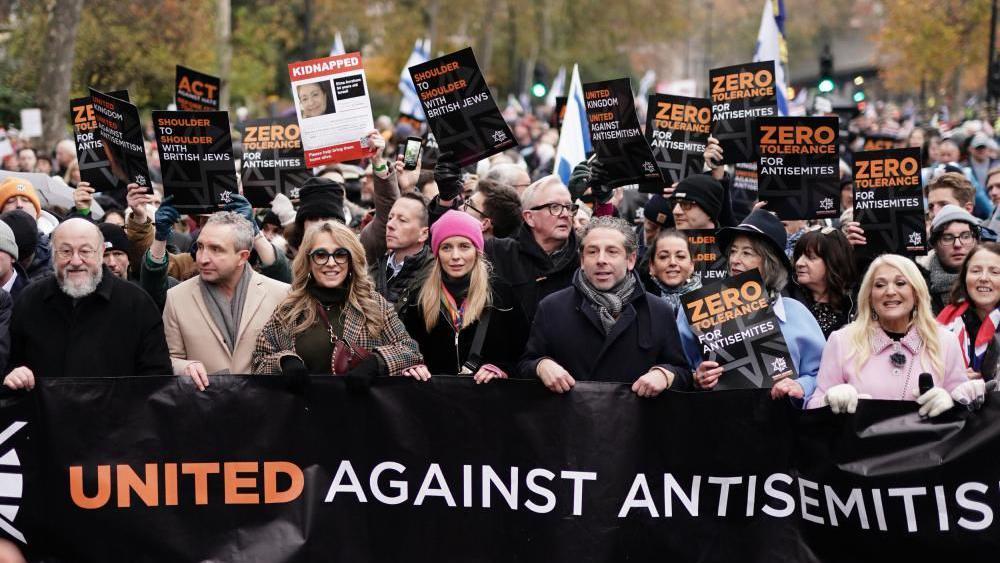 Chief Rabbi Mirvis, Eddie Marsan, Tracey-Ann Oberman, Rachel Riley, Maureen Lipman and Vanessa Feltz take part in a march against antisemitism organised by the volunteer-led charity Campaign Against Antisemitism at the Royal Courts of Justice in London