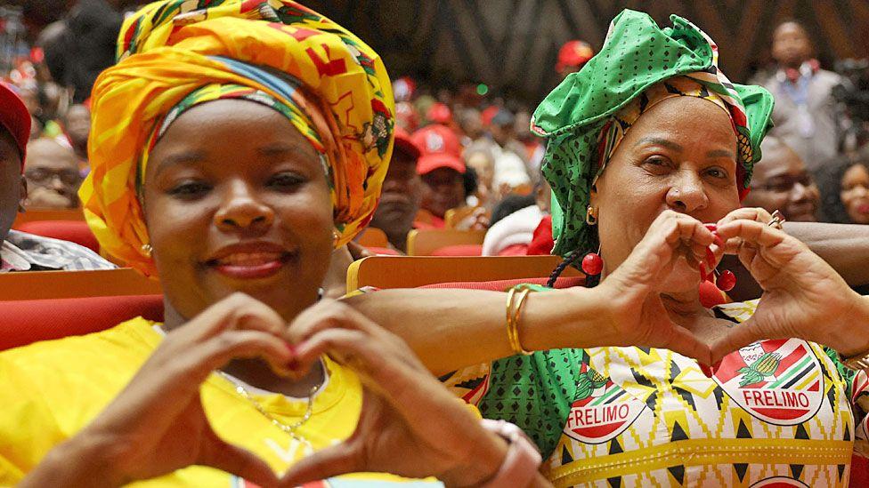 Supporters of the presidential Frelimo candidate Daniel Chapo make love heart gestures at electoral meeting in Maputo - 2 October 2024