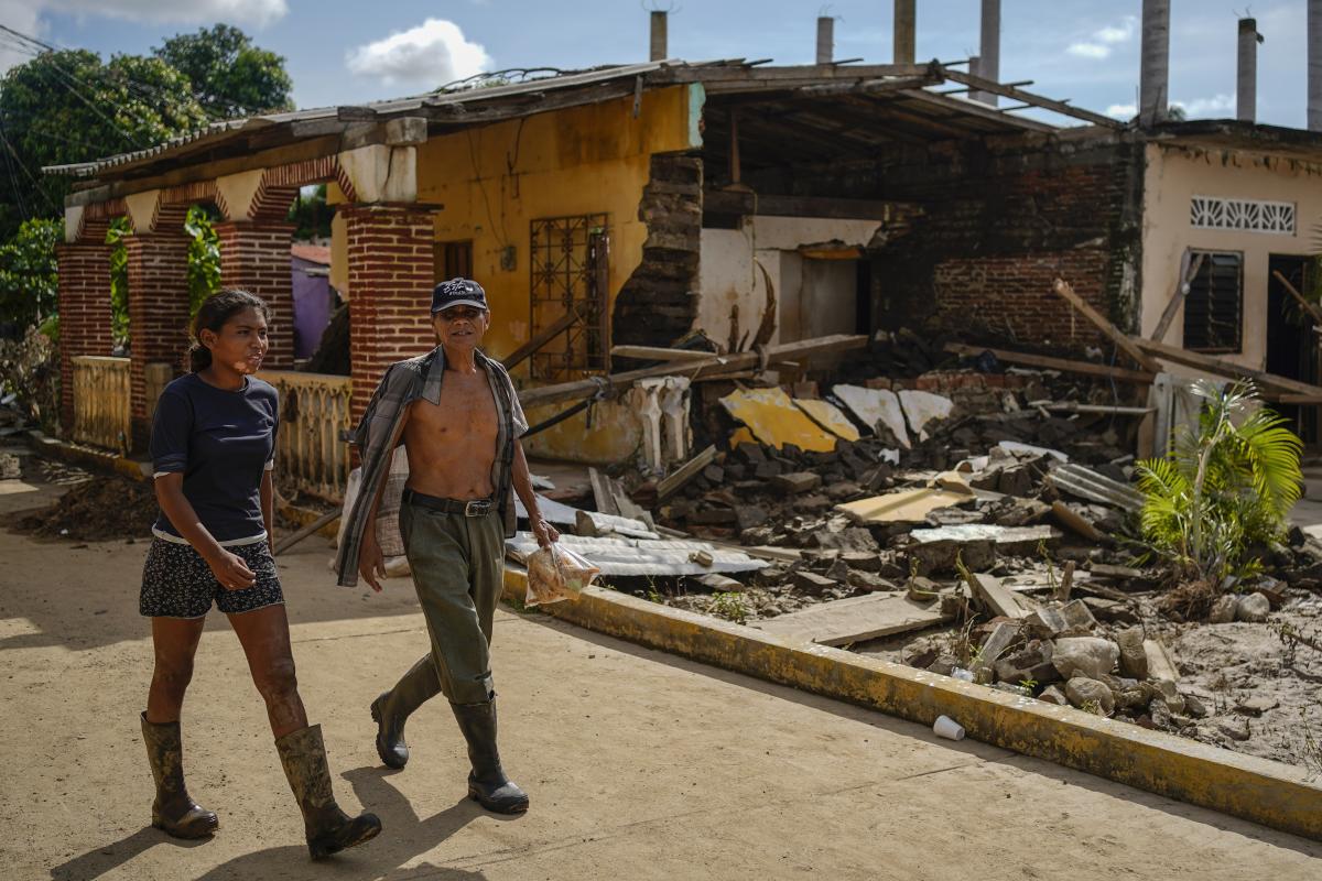 Along Mexico's Pacific coast, flooding from Hurricane John left devastated towns and 15 dead